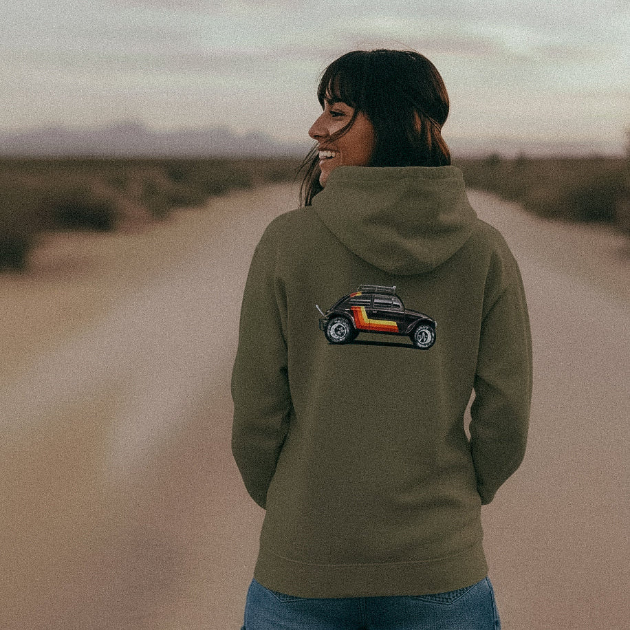 Woman stands in the desert wearing a 'Stripes' Baja Bug hoodie in Khaki.