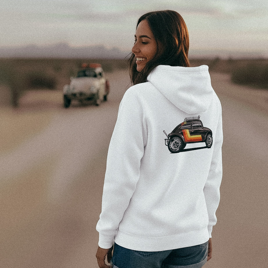 Woman stands in front of a VW Baja Bug wearing a 'Stripes' Baja Bug hoodie in White.