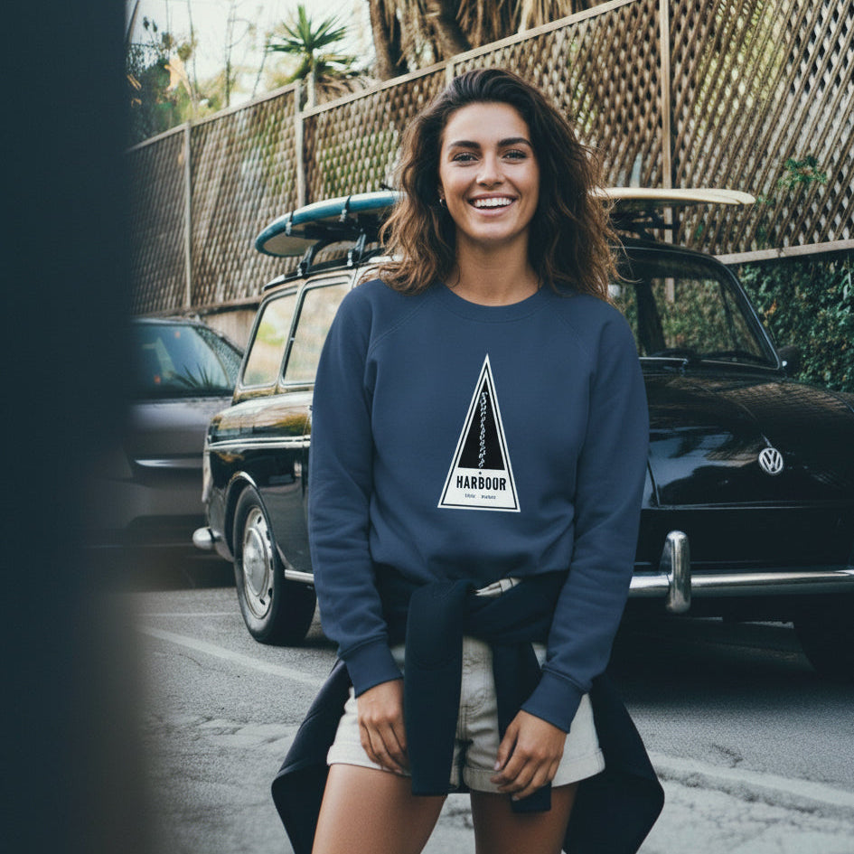 Woman stands in front of a VW Squareback wearing a French Navy Harbour Surfboards Sweatshirt.